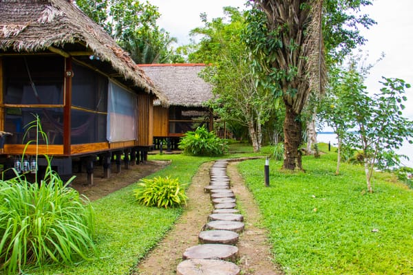 Cabanas along the rivers edge Inkaterra Reserva Amazonica