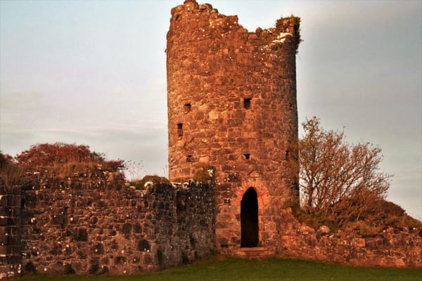 The stones of Crom Castle dyed pink by the sunset