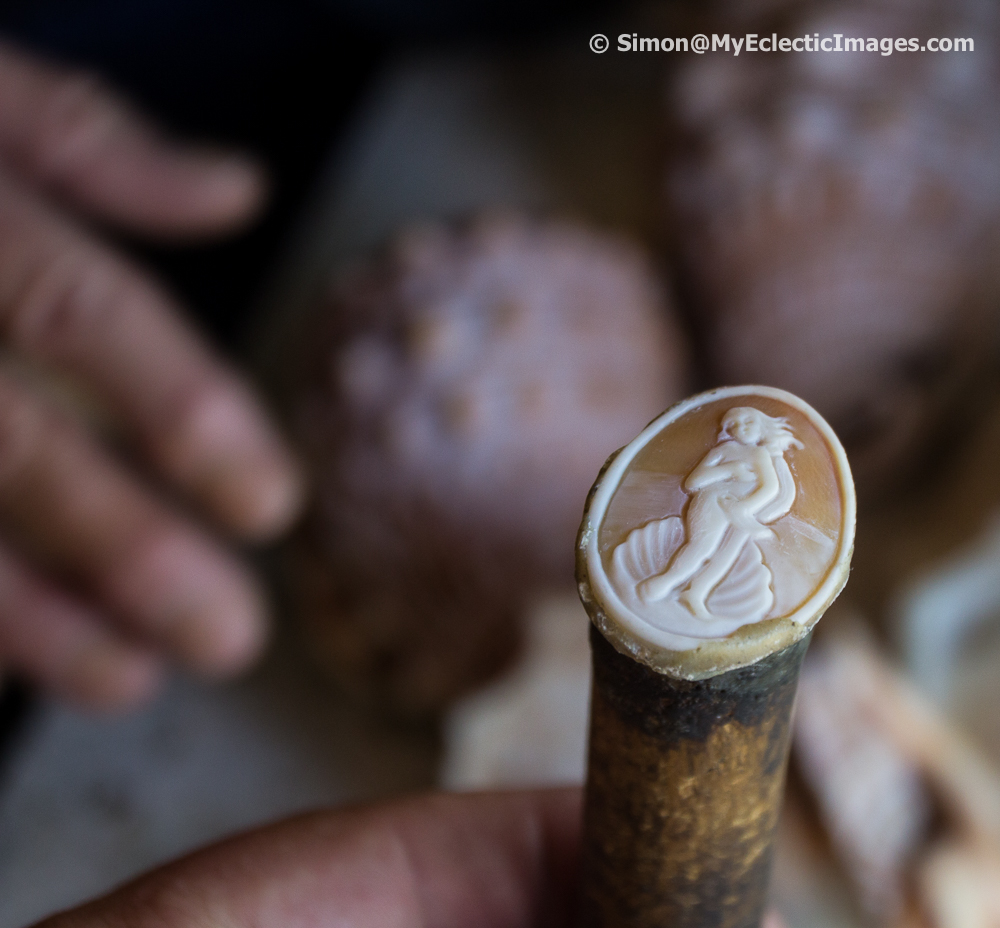 Cameo mounted on the support tool that is used for holding the cameo steady while it is being carved