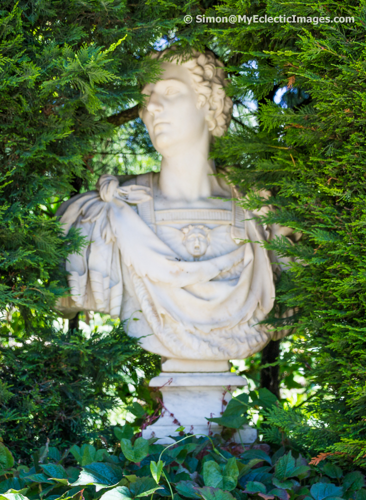 Roman style sculpture buried in greenery - Santa Clotilde Gardens